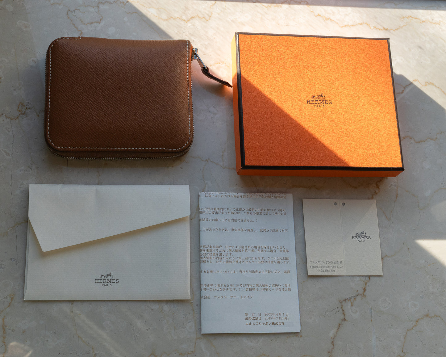 Hermès Silk'In Compact Leather Wallet featuring gold epsom leather