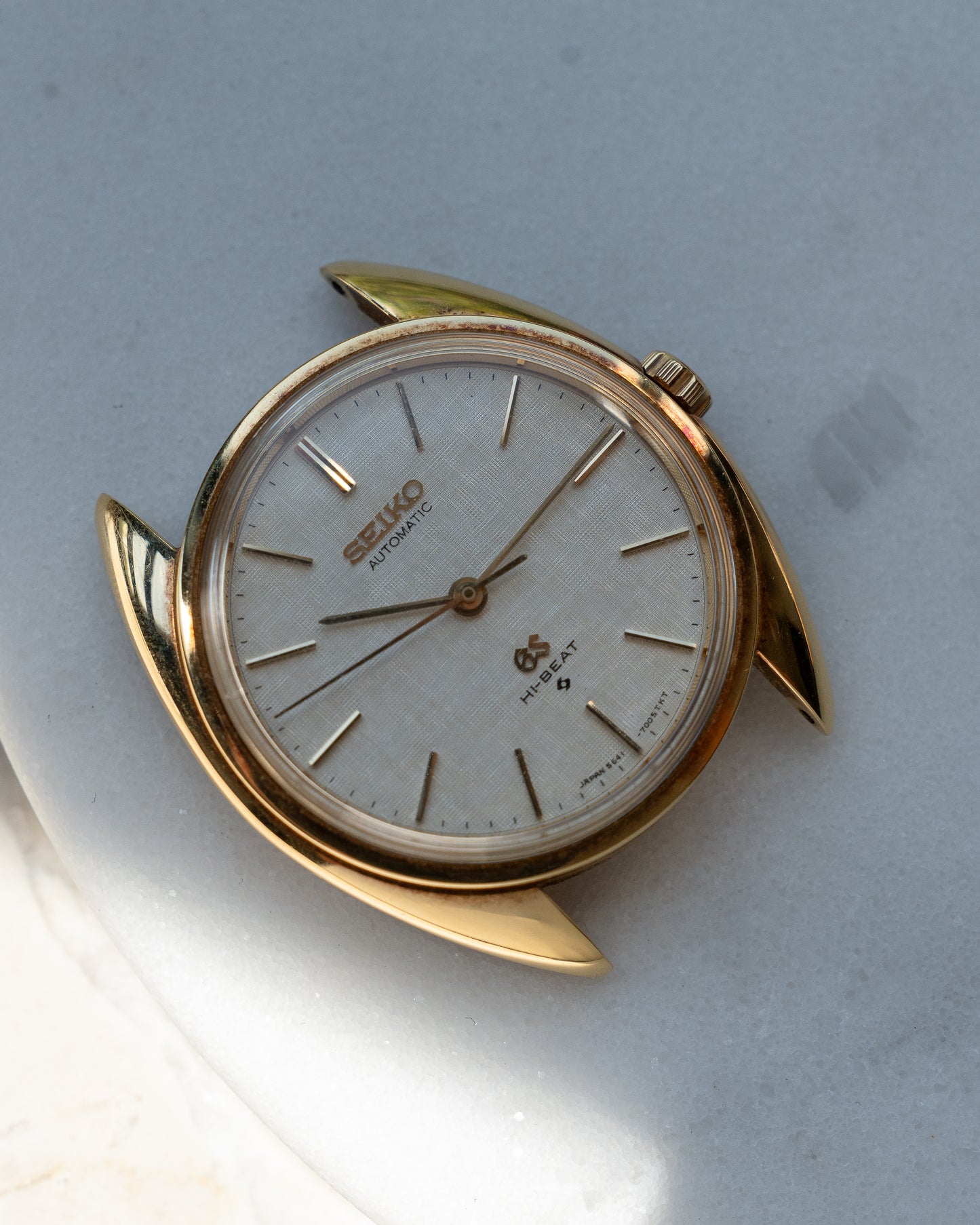 Grand Seiko 5641-7005 linen dial in 18k Yellow Gold, April 1971 with GS gold buckle