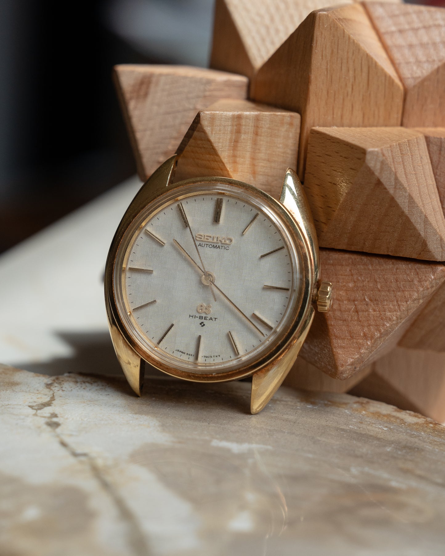 Grand Seiko 5641-7005 linen dial in 18k Yellow Gold, April 1971 with GS gold buckle