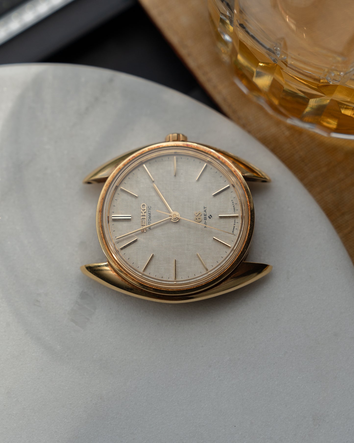 Grand Seiko 5641-7005 linen dial in 18k Yellow Gold, April 1971 with GS gold buckle