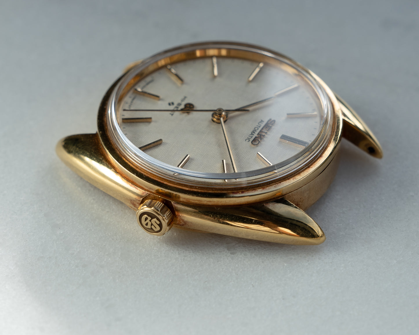 Grand Seiko 5641-7005 linen dial in 18k Yellow Gold, April 1971 with GS gold buckle