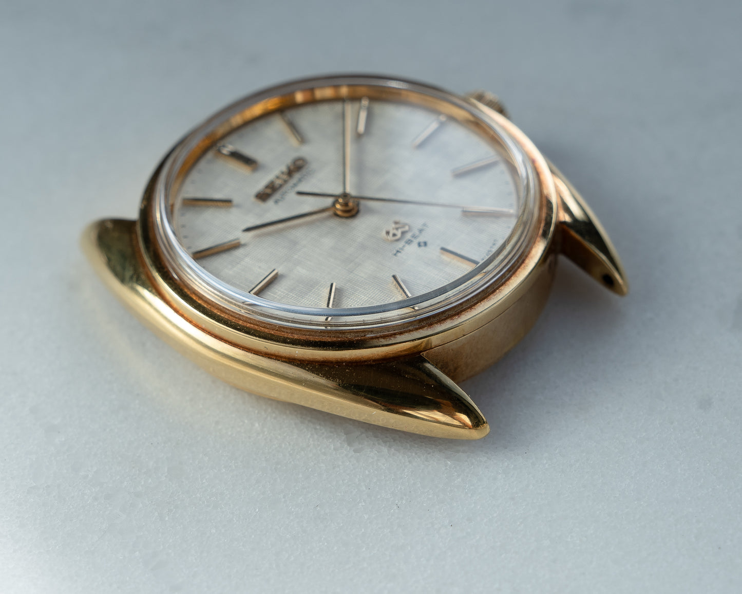 Grand Seiko 5641-7005 linen dial in 18k Yellow Gold, April 1971 with GS gold buckle