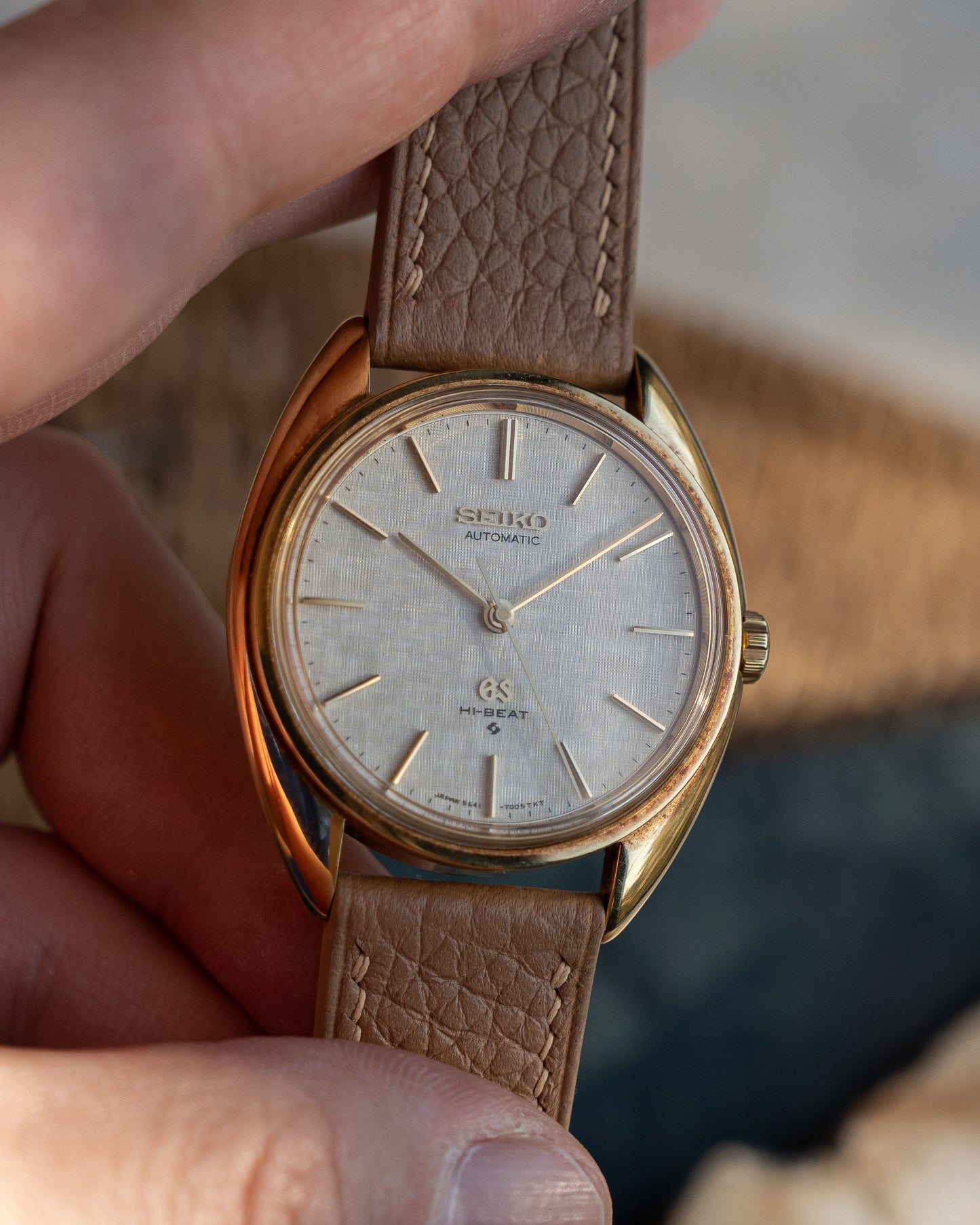 Grand Seiko 5641-7005 linen dial in 18k Yellow Gold, April 1971 with GS gold buckle