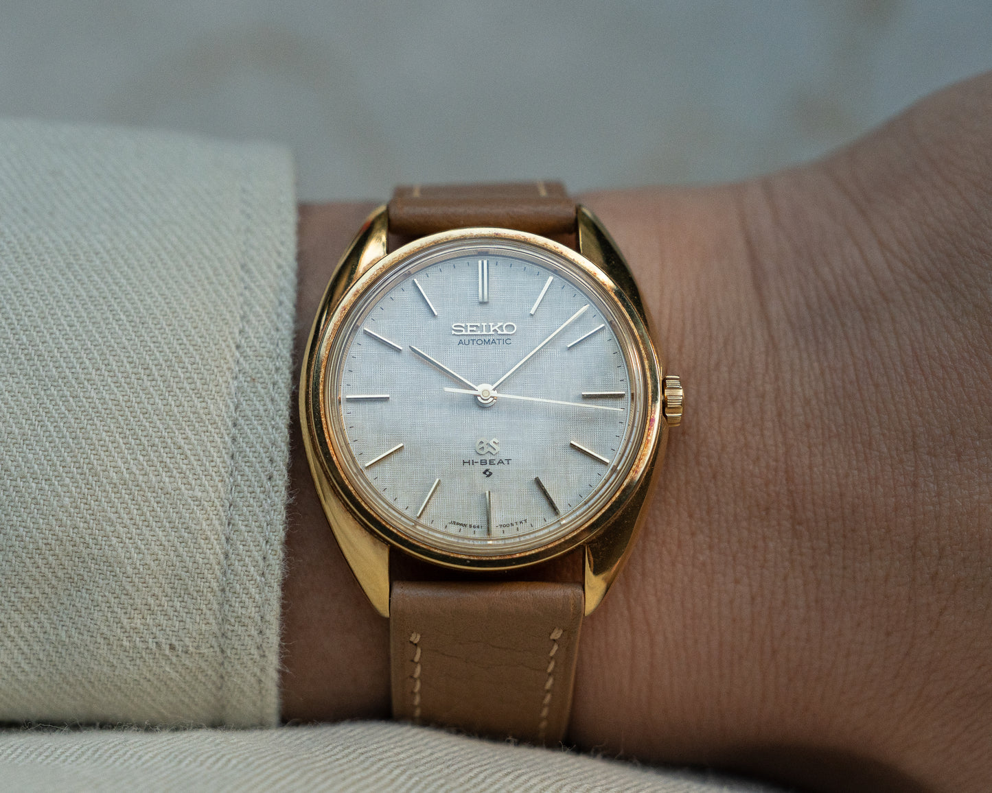 Grand Seiko 5641-7005 linen dial in 18k Yellow Gold, April 1971 with GS gold buckle