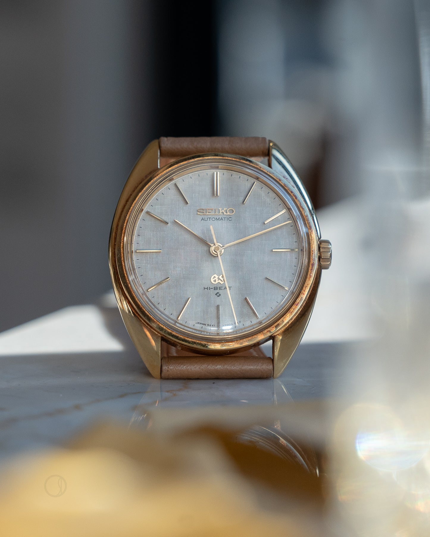 Grand Seiko 5641-7005 linen dial in 18k Yellow Gold, April 1971 with GS gold buckle